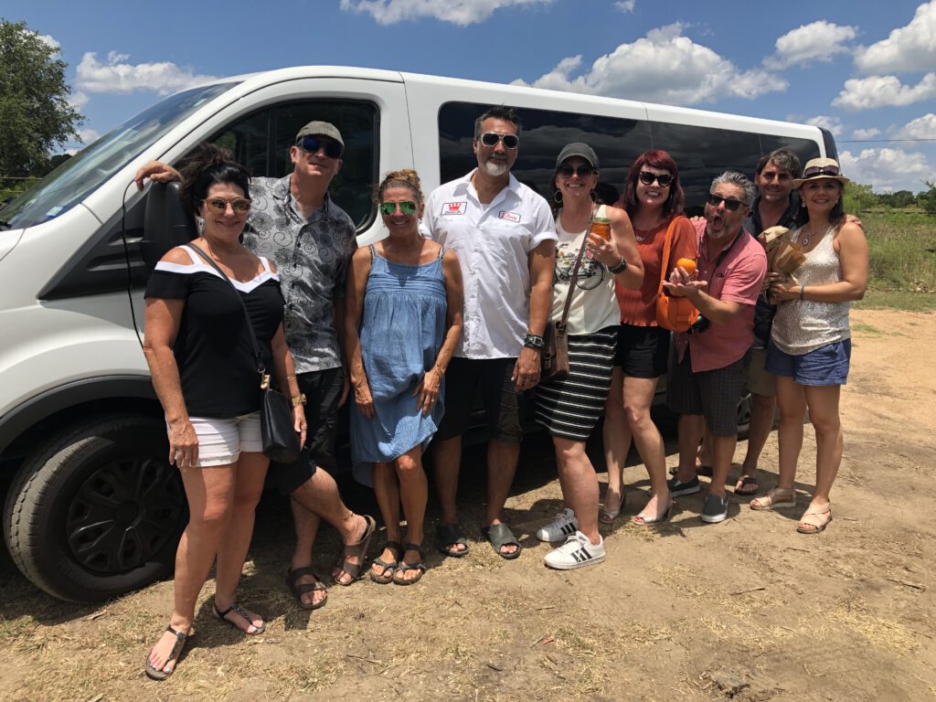A Group Enjoying Their Private Custom Dripping Springs Wine And Distillery Tour